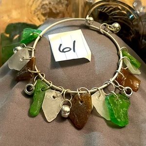 Silver tone bangle bracelet made with sea glass